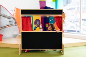 Children giving puppet show